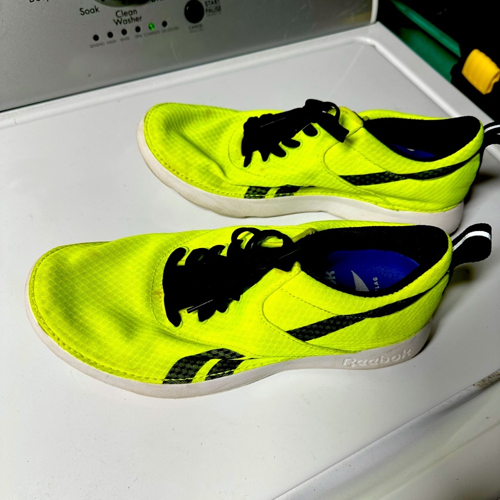 Reebok running shoes, size 9. Usual wear on tread and soles, but no tearing.